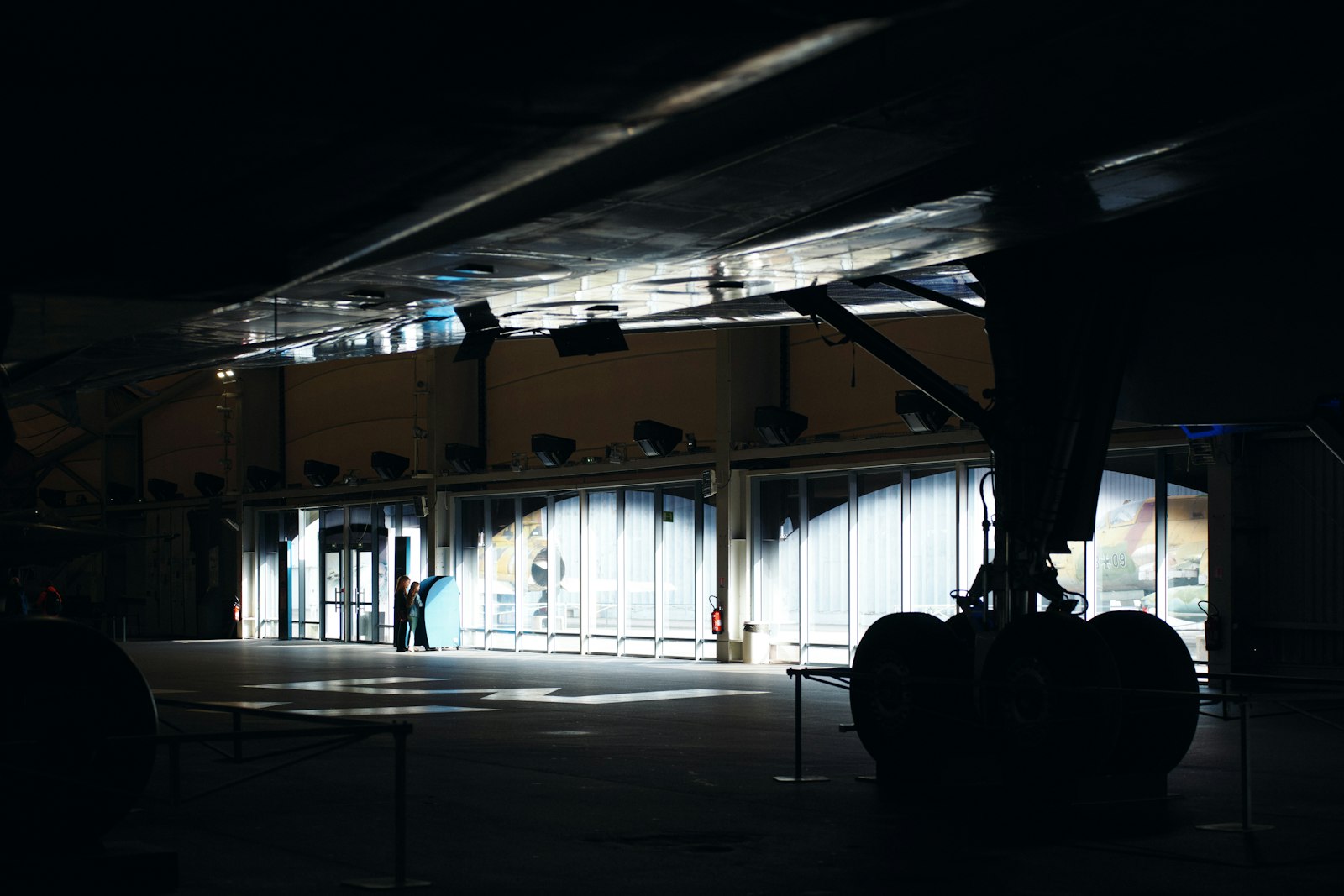 Landing gear in a dimly lit hangar